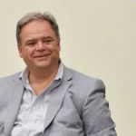Paolo Condo, seduto sorridente